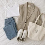 capsule wardrobe essentials flat lay of neutral clothing
