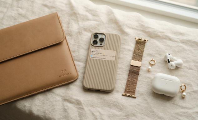 aesthetic tech accessories flat lay with phone case and laptop sleeve