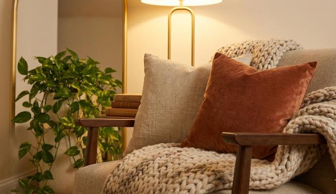 layered knit and linen textiles for a cozy reading nook